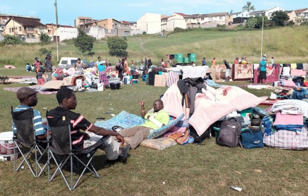 13.-An-injured-foreign-national-C-gestures-to-his-local-countrymen-at-the-Chatsworth-football-grounds-south-of-Durban-on-April-10-2015-Photo-RAJESH-JANTILAL-AFP Municipality investigating allegations of theft at xenophobia camp